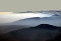 Distant mountain silhouette with clear sky and soft light Royalty Free Stock Photo