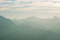 Distant mountain silhouette with clear sky and soft light. Toned image, vintage filter, split toning. Royalty Free Stock Photo