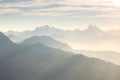 Distant mountain silhouette with clear sky and soft light. Toned image, vintage filter, split toning. Royalty Free Stock Photo