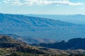 Distant mountains at high elevation in cliffs and hills of arizona wild west in the great outdoors with cloudy blue sky