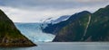 Distant panoramic view of a Holgate glacier with waterfall on the side in Kenai fjords National Park, Seward, Alaska, United Royalty Free Stock Photo