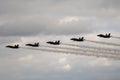 Distant shot of the Blue Angels performing an air show before the clouds, US Navy Royalty Free Stock Photo