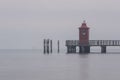 Distant shot of the lighthouse of Lignano Sabbiadoro in gloomy weather in Udine, Italy