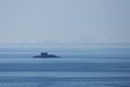 Distant silhouette of submarine ship and the crew