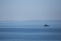 Distant silhouette of submarine ship and the crew