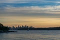 Distant silhouette of Sydney cityscape at dusk, on sunset Royalty Free Stock Photo