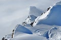 Distant snow covered peaks above clouds Royalty Free Stock Photo