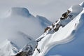 Distant snow covered peaks above clouds Royalty Free Stock Photo