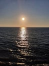 Distant sunset at dusk over sea Royalty Free Stock Photo