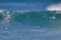 Surfers waiting for a turn to ride a wave. Royalty Free Stock Photo