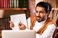 Indian Teacher Guy Having Class Via Video Call Sitting Indoors Royalty Free Stock Photo