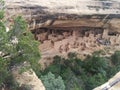 Distant tourist group at ancient ruins at Mesa Verde National Park Royalty Free Stock Photo