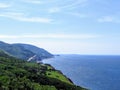 A distant view of the Cabot Trail on Cape Breton Island, Nova Scotia, Canada. The beautiful coastal highway provides amazing view Royalty Free Stock Photo
