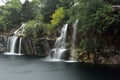 Distant view of cascading waterfalls in Wisconsin during a rainstorm Royalty Free Stock Photo