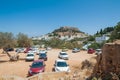 Distant view at Lindos Town and Castle with ancient ruins of the Acropolis on sunny warm day. Island of Rhodes, Greece. Europe Royalty Free Stock Photo