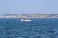 Distant view on the little boat and the coast on the northern sea island juist germany Royalty Free Stock Photo