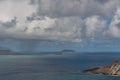 A distant view of a rainstorm at the Makapuu Point, east Oahu Royalty Free Stock Photo