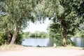 Distant view on the river ems through trees in lathen emsland germany Royalty Free Stock Photo