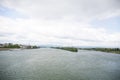 Distant view on the riverbanks of the rhine river and cloudy sky in mainz germany Royalty Free Stock Photo