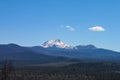 Distant view of snow covered Mt Shasta which is a potentially active volcano at the southern end of the Cascade Range in Siskiyou Royalty Free Stock Photo