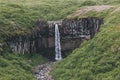 distant view of Svartifoss (Black fall) waterfall