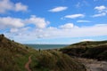 Distant walker on Berwickshire Coastal Path UK