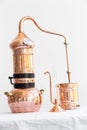 Distillation of lavender essential oil. Copper alambic in a Scandinavian interior.