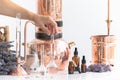 Distillation of lavender essential oil. Copper alambic in a Scandinavian interior. Chemical laboratory