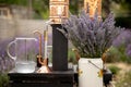 Distillation of lavender essential oil and hydrolate. Copper alambic for the flowering field.