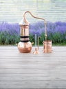 Distillation of lavender essential oil and hydrolate. Copper alambik for the flowering field.