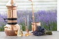 Distillation of lavender essential oil and hydrolate. Copper alambik for the flowering field. Royalty Free Stock Photo