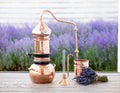 Distillation of lavender essential oil and hydrolate. Copper alambik for the flowering field.