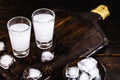 Distilled drink,anise base, on wooden background. Traditional Turkish and Greek appetizer, known as Ouzo, Uzo, Raki, arak or raki Royalty Free Stock Photo