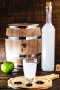 Distilled drink,anise base, on wooden background. Traditional Turkish and Greek appetizer, known as Ouzo, Uzo, Raki, arak or raki Royalty Free Stock Photo