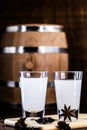 Distilled drink,anise base, on wooden background. Traditional Turkish and Greek appetizer, known as Ouzo, Uzo, Raki, arak or raki