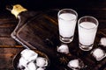 Distilled drink,anise base, on wooden background. Traditional Turkish and Greek appetizer, known as Ouzo, Uzo, Raki, arak or raki