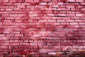 Distinctive pink brick wall textured with aged, shabby, cracked paint