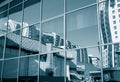 Distorted environment reflected in glass wall of office building Royalty Free Stock Photo