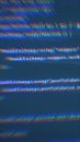 Distorted programming code on a digital screen with RGB chromatic aberration and glitch effects Royalty Free Stock Photo