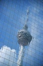 Distorted reflection of Kuala Lumpur Tower in building wall full frame