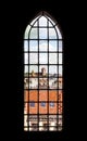 Distorted view of Torun old town seen through church stained glass, Poland.