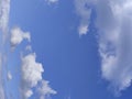 Distorted white clouds over blue sky background Royalty Free Stock Photo
