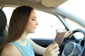 Distracted driver reading phone message driving a car