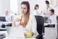 Distracted pregnant woman at work Royalty Free Stock Photo