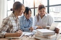 Distracted from preparing college project happy young laughing diverse classmates having fun, telling jokes, enjoying Royalty Free Stock Photo