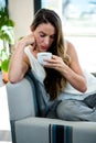 distracted woman, sipping a cup of coffee