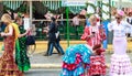 Distracted women wearing traditional flamenco dress at the April Fair Seville Royalty Free Stock Photo