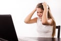 Distraught girl behind a laptop Royalty Free Stock Photo