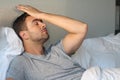 Distraught man with hand in forehead Royalty Free Stock Photo