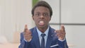 Distraught Young African Businessman Talking in Anger and Stress Royalty Free Stock Photo